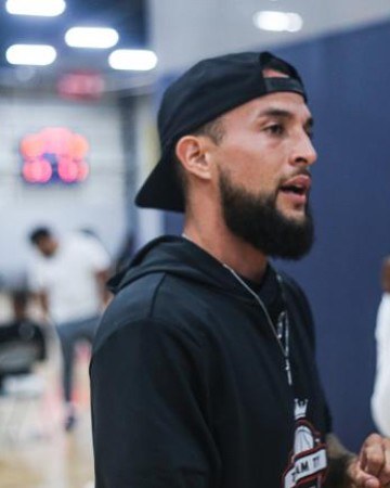 Ty Alexander Traufield — Coach Ty — coaching from the sideline at a basketball gym in Florida